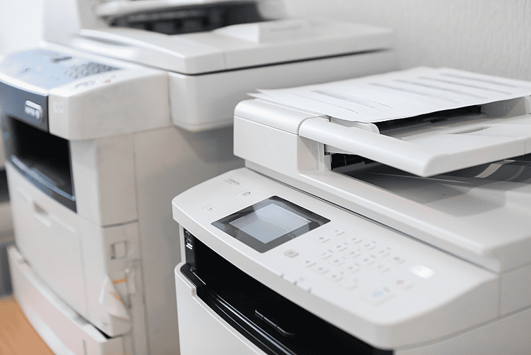 Two copiers side by side, representing grenke’s asset financing solutions for businesses of all sizes. Ideal for entrepreneurs and multinational companies seeking flexible copier leasing options.
